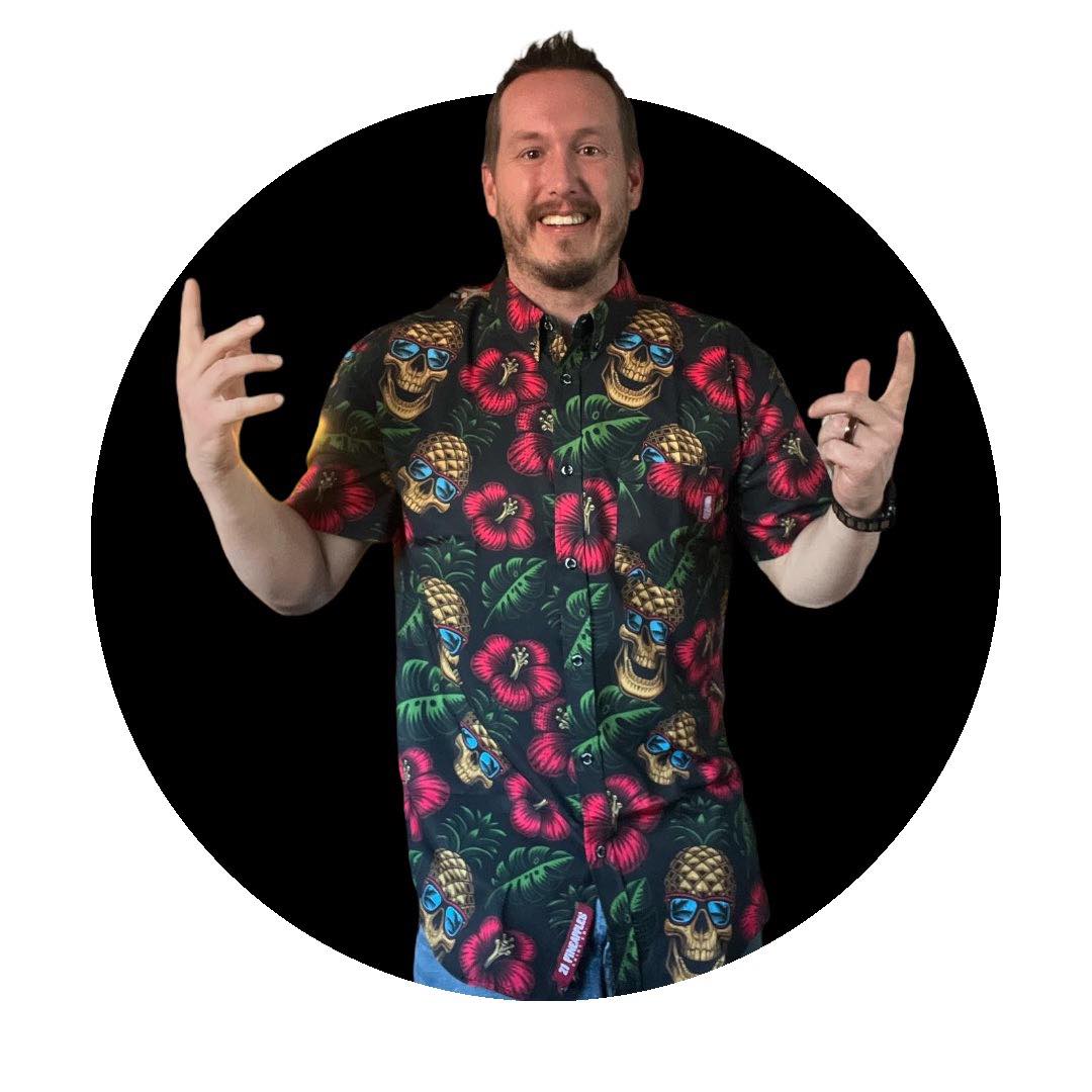 Mark G, host of Toxic Boxes, throwing rock-hand gestures in a skull-print shirt